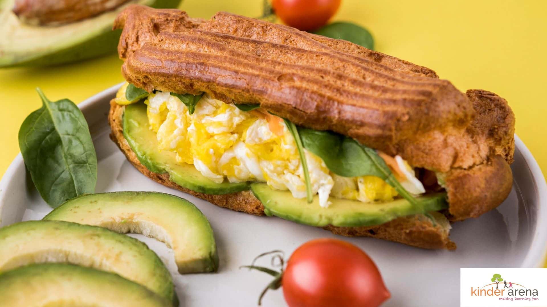 Healthy lunchbox idea for children, egg sandwich with fruit and cucumber sticks